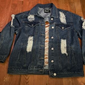 Extremely distressed denim jacket in good condition